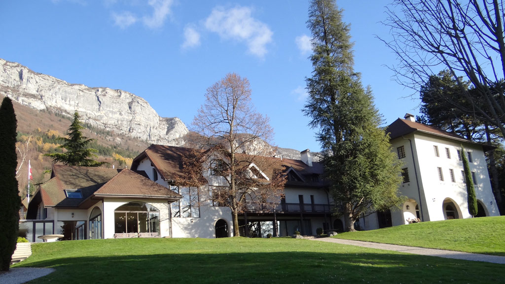Les Pensières Center for Global Health, Veyrier-du-Lac, Annecy, France, the venue for ICCBH Bone School 2023 with mountains behind